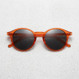 Frame: Amber / Brown Tortoiseshell Lens: Dark Brown